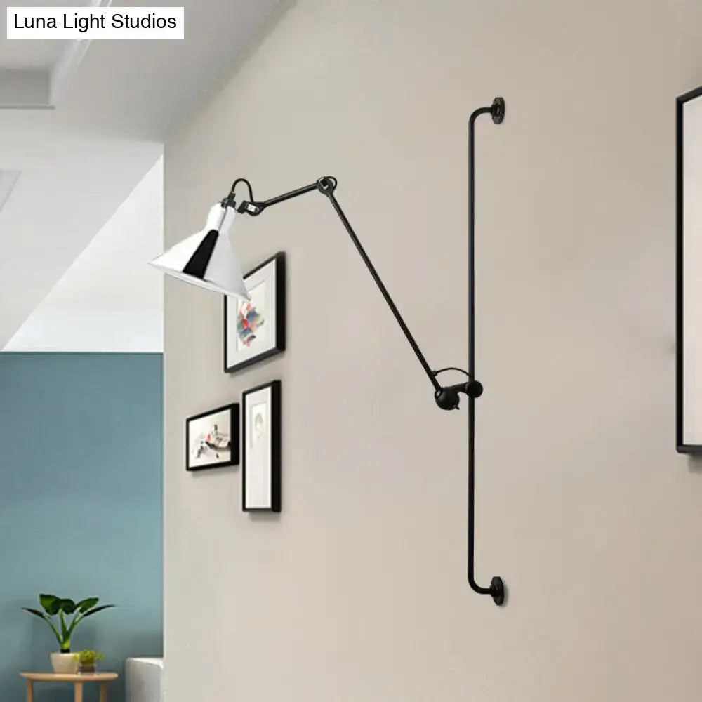 Modern black and white articulated bedroom wall lamp direct wired with a white conical shade and black triangular accent