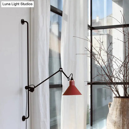Red conical shade modern wall-mounted lamp with black articulated arm and base for direct wired electric use