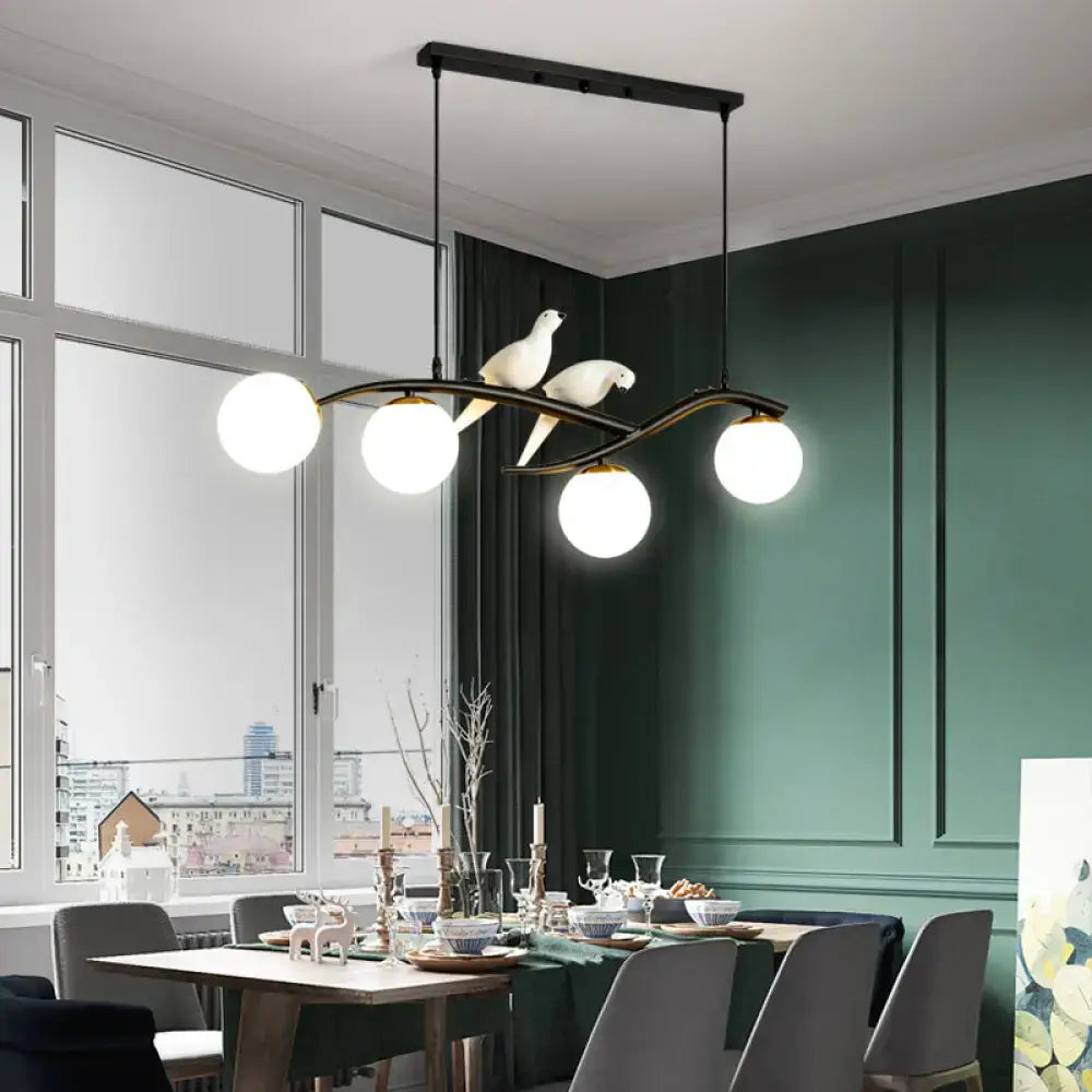 DecorBites™ modern black metal dining room island light pendant with four white glass bulbs, doves, and adjustable cord length