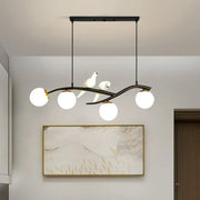 Modern black and white bird linear island pendant light with three spherical glass shades for dining room use