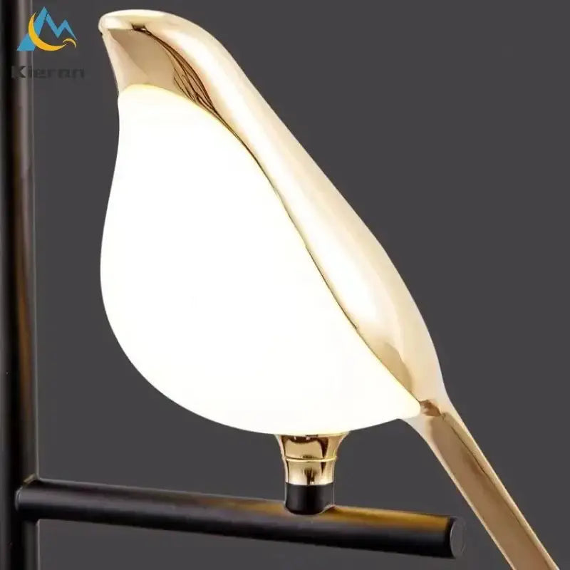 Modern black and white crow led floor lamp with gold-toned bird design and glossy illuminated white glass body decorbites crow led