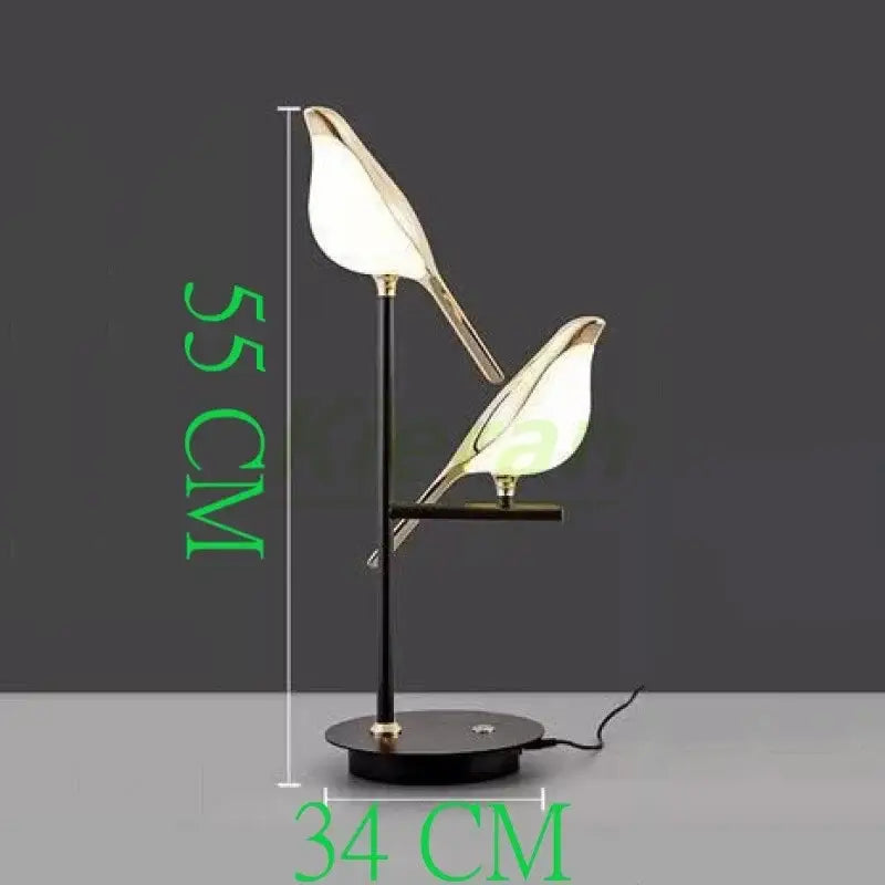 Modern black floor lamp with two illuminated bird-shaped shades and gold trim decorbites crow led floor detail
