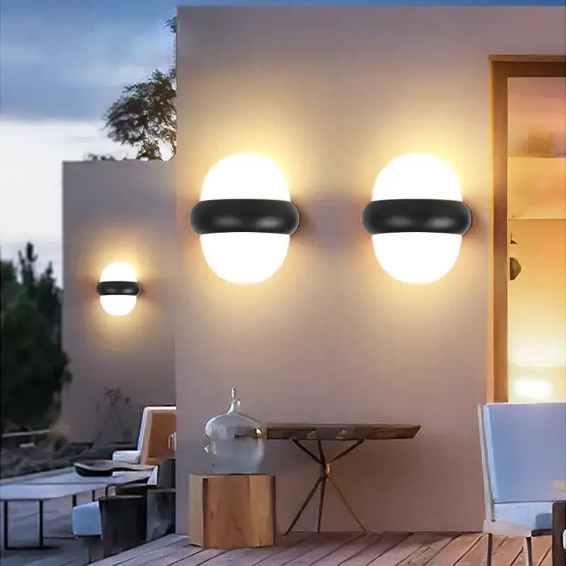 Modern black and white dome led wall lamp with frosted glass shades as a stylish lighting solution for bedroom and garden