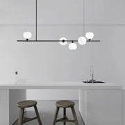 Modern black metal pendant lamp with five frosted white glass globes for dining room lighting