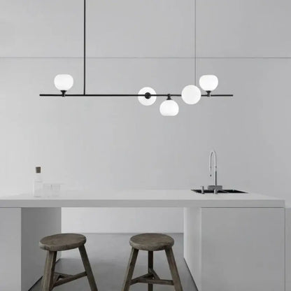 Modern black metal pendant lamp with five frosted white glass globes for dining room lighting