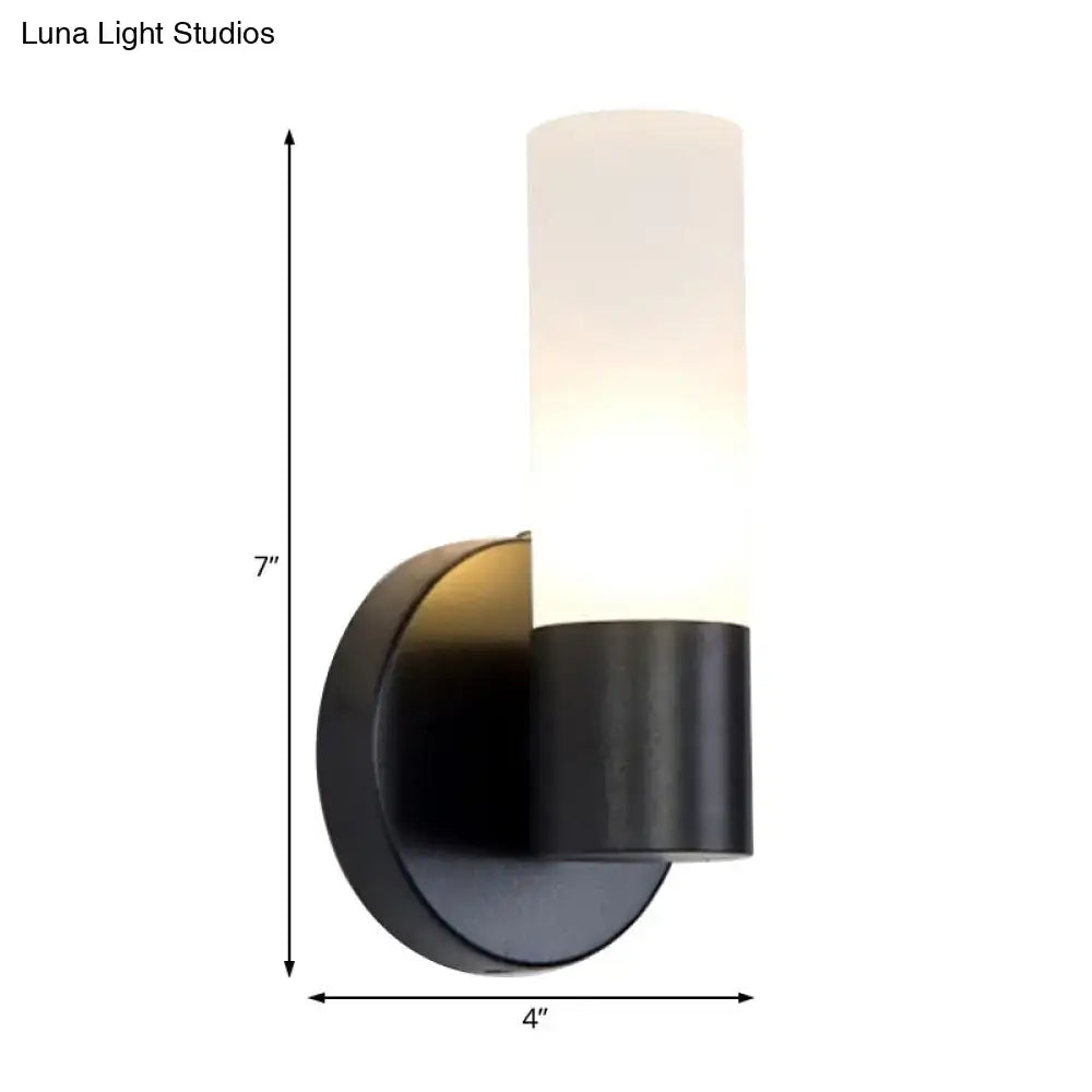 Modern black and white glass sconce lamp featuring a cylinder white glass diffuser for bedroom wall light use