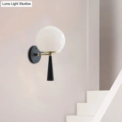 Modern black and white glass wall sconce light fixture with frosted white glass globe and brass hardware for 220v-240v use