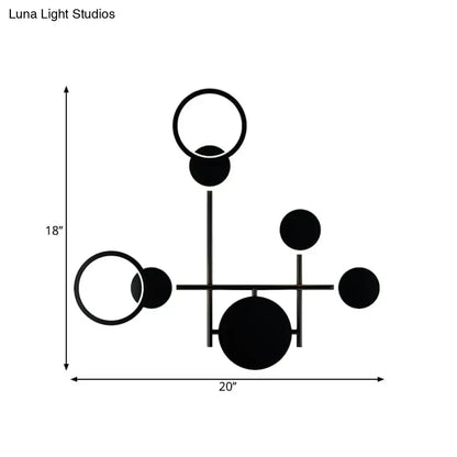 Modern black and white metallic round led wall sconce with minimalist abstract geometric spheres and rings for living room