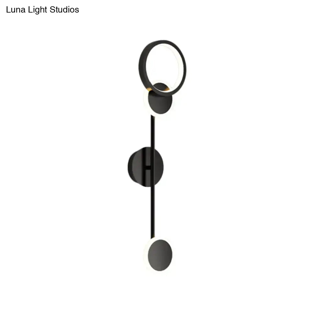 Modern black and white metallic round led wall sconce with circular fixtures and sleek vertical rod for living room lighting