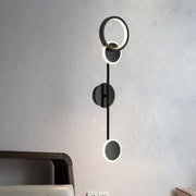 Modern black and white metallic round led wall sconce with sleek minimalist design for living room lighting