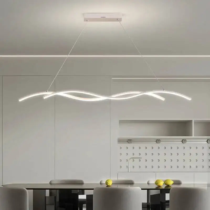 Modern black and white rectangular led pendant light with sleek wavy design suspended above dining table for dining room