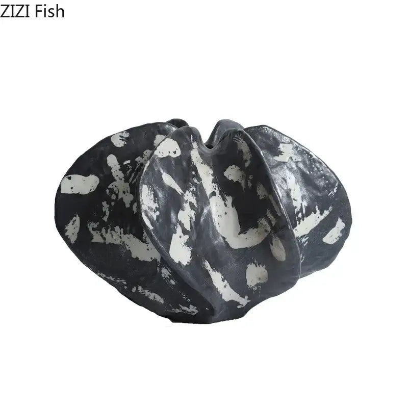 Modern black and white starfruit coral ceramic sculpture with textured organic form for bedroom decor