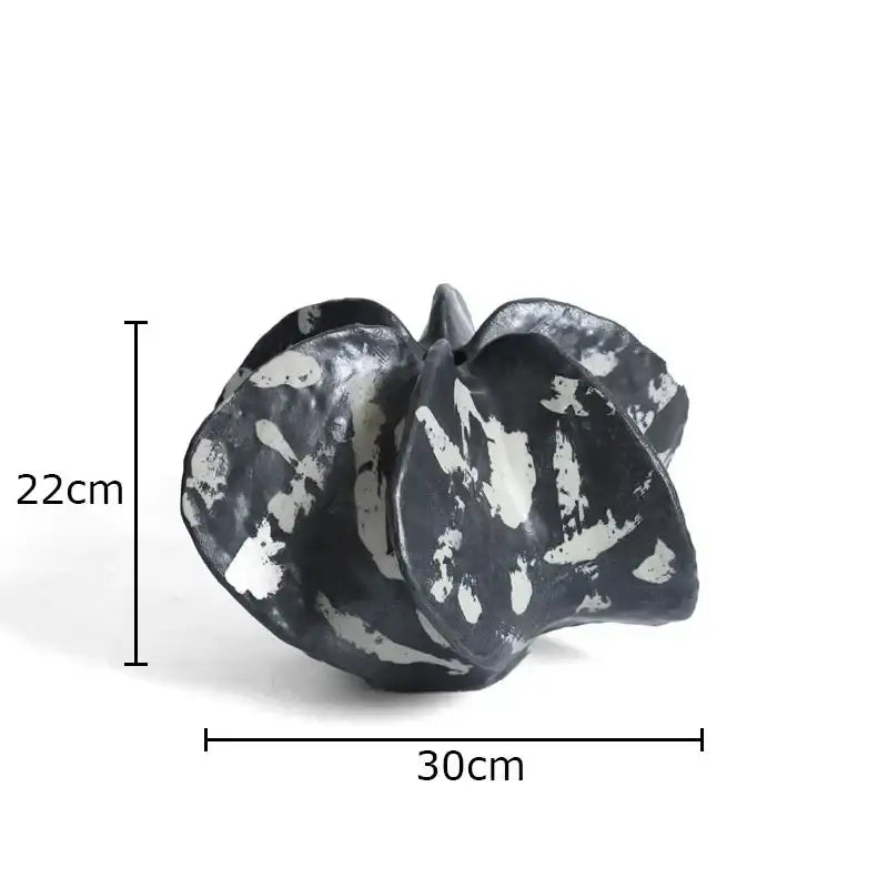 Modern black and white ceramic black starfruit coral sculpture with textured abstract leaf form for bedroom decor