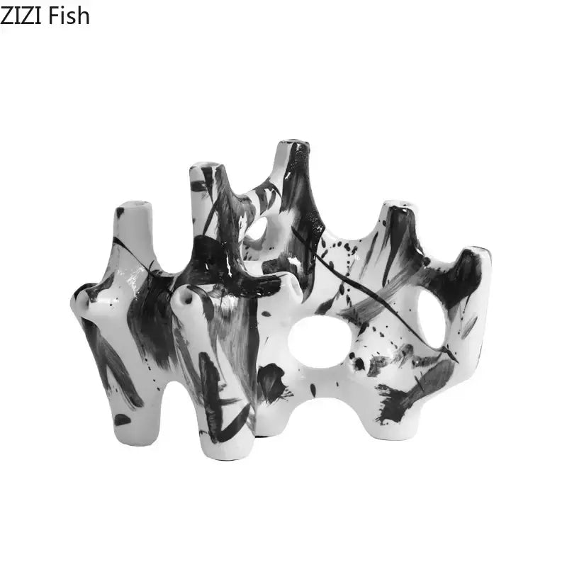 Modern black and white starfruit coral ceramic sculpture with brushstroke patterns for bedroom decor