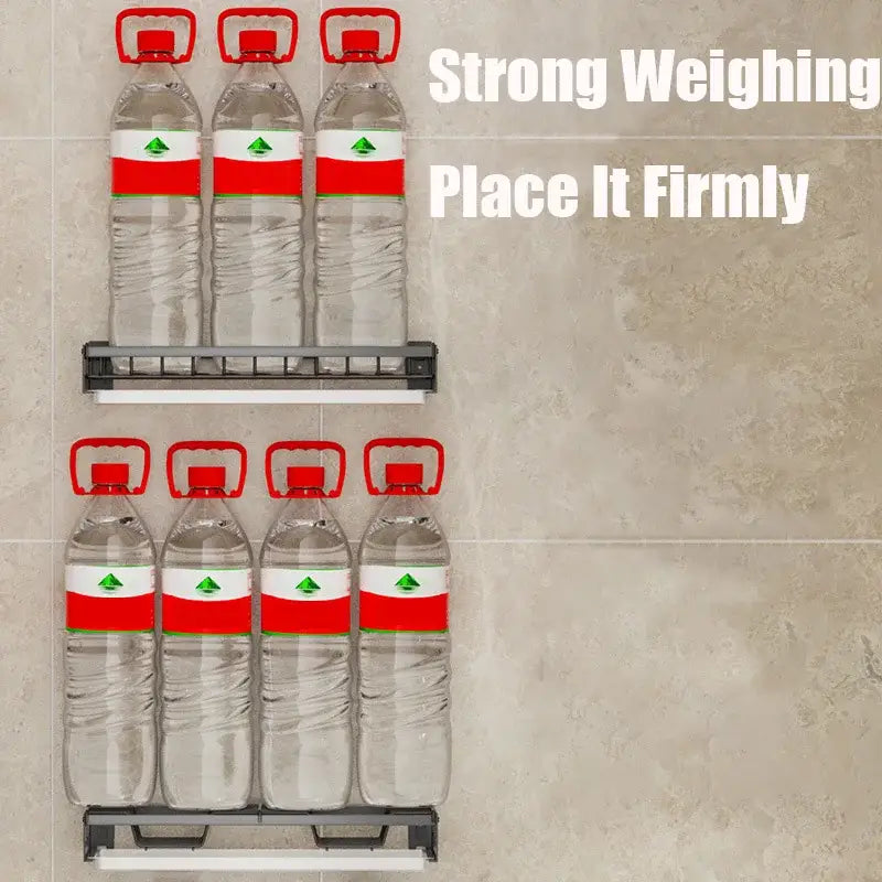 Modern black metal wall-mounted dish drainer rack holding six clear water bottles with red caps and white labels
