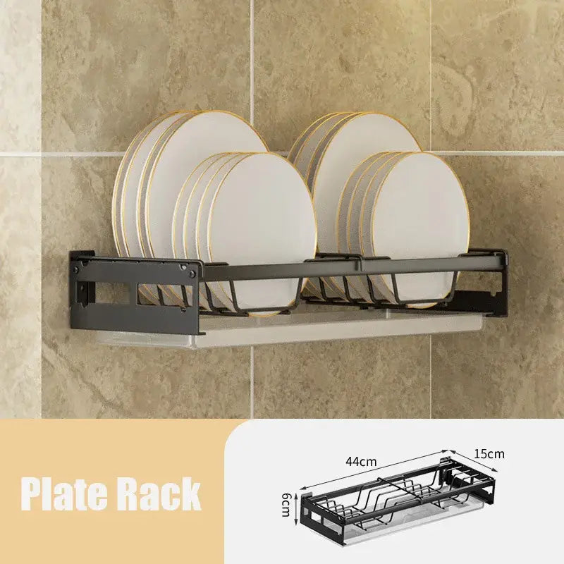 Modern black metal dish drainer rack with two tiers holding white plates edged in gold for kitchen storage