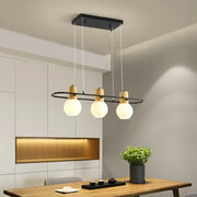 DecorBites black orb island pendant light with frosted glass hanging globes and wood-toned rectangular ring frame