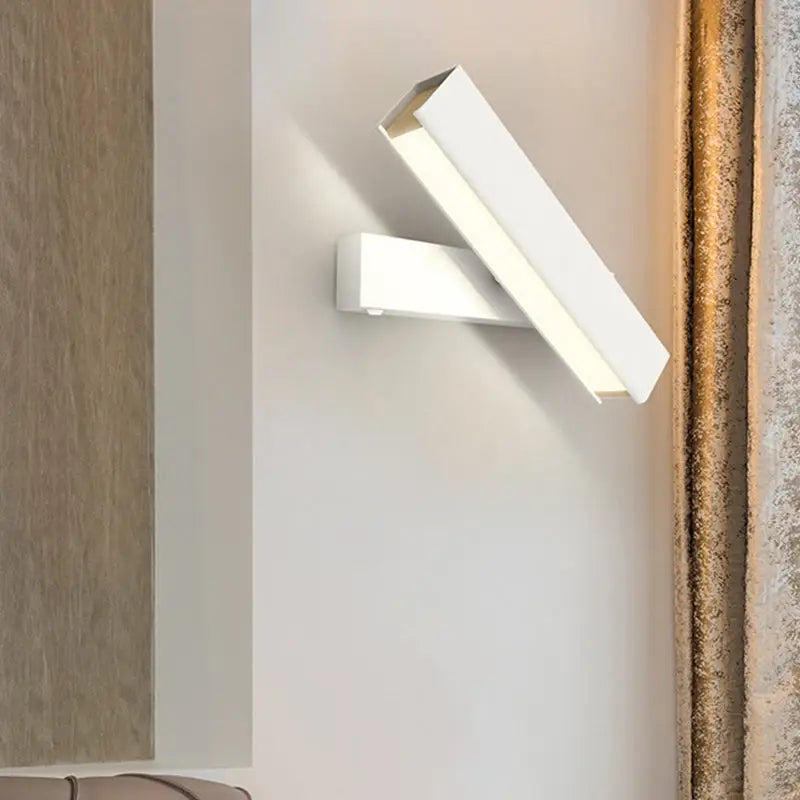 Modern white rectangular led sconce lamp with sleek minimalist design for bedroom featuring rotatable black and wood elements