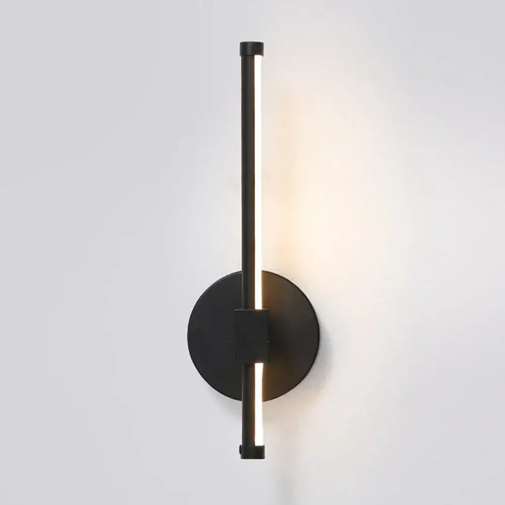 Modern black angular indoor led wall light with sleek vertical led bar and circular base for bedroom decorbites indoor led use