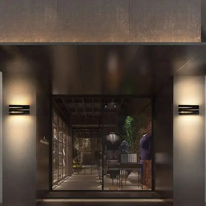 The ovs store entrance features modern black angular metal ip65 outdoor wall lamps for villa porch lighting