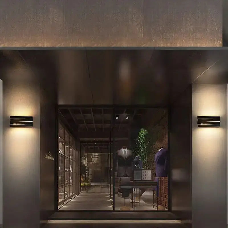 The ovs store entrance features modern black angular metal ip65 outdoor wall lamps for villa porch lighting
