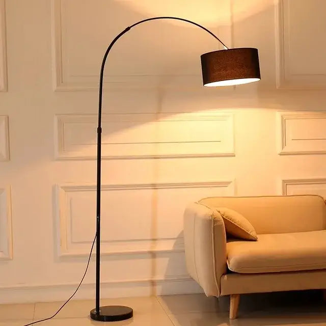 Modern black arched led floor lamp with cylindrical brown fabric shade for living room use