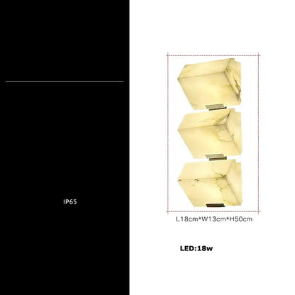 Three-tiered wall light with translucent veined onyx-like stone cubes and slim black art deco marble decorbites base