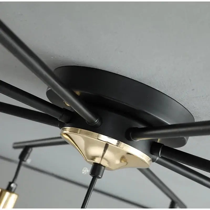 Modern black art glass ball molecule chandelier featuring black and brass radial arms for living room decorbites art glass lighting