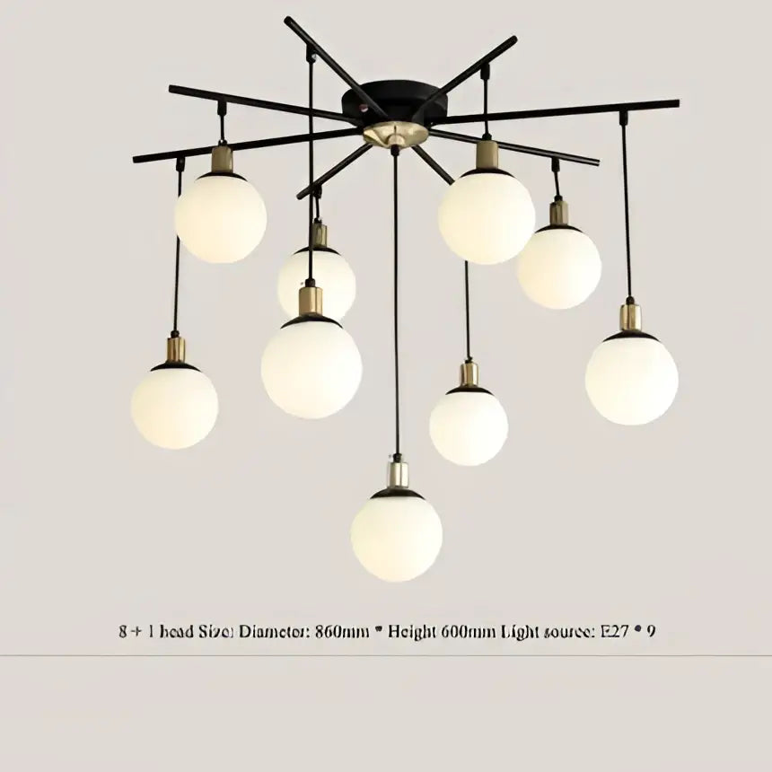 Modern black metal chandelier with nine frosted glass globes for living room decor featuring decorbites art glass ball molecule design