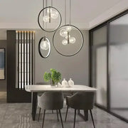 Modern black ball bubble led pendant light with metal frame and clear glass orbs for dining room chandelier