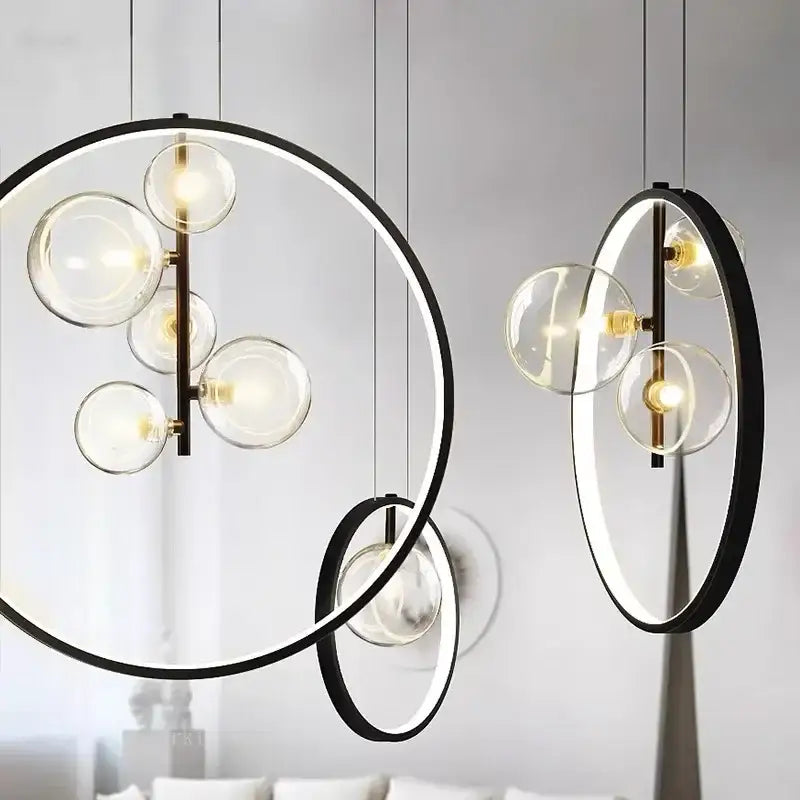 Modern black ball bubble led pendant light with clear glass globes and gold fixtures for dining room chandelier