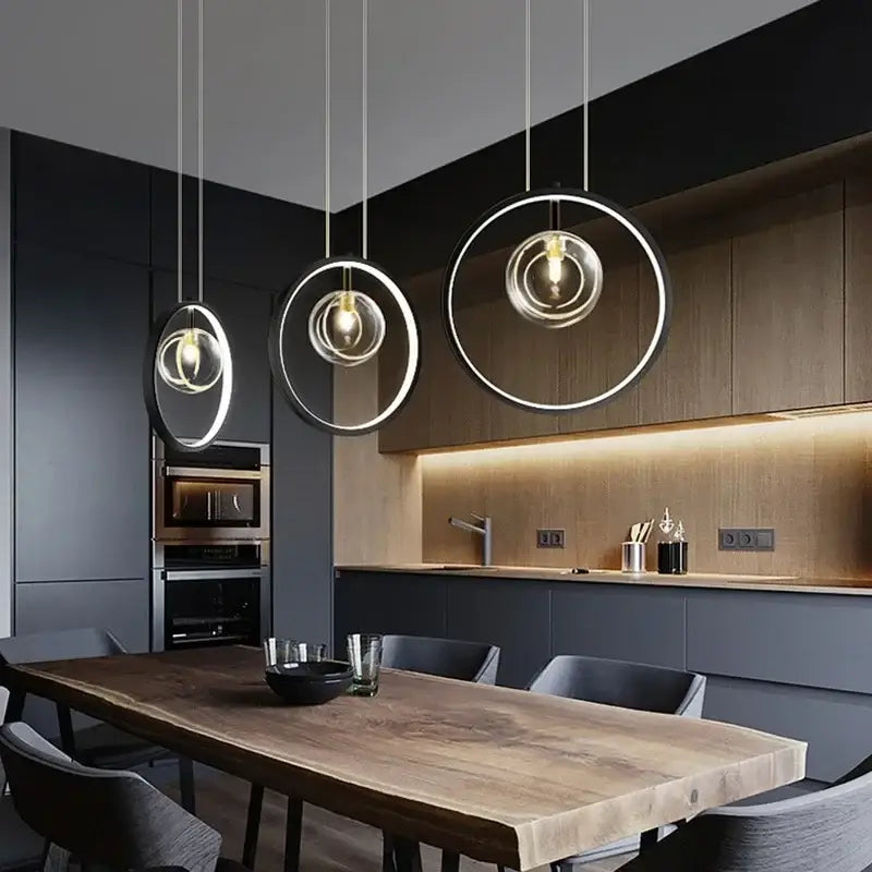Three modern black pendant lights with circular frames and clear glass globes for dining room ball bubble led chandelier