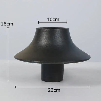 Modern black bell shaped decorbites ceramic vase with flared rim and cylindrical base for stylish desktop decor