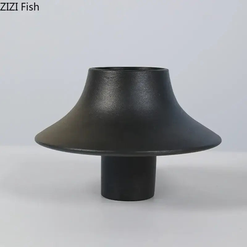 Modern black bell shaped decorbites ceramic vase with matte finish and cylindrical base for desktop decor