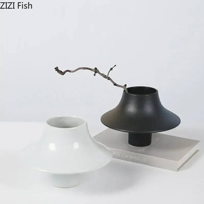 Modern black bell shaped decorbites ceramic vase with wide flared top and narrow base for desktop decor