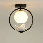 Modern black bird ceiling light fixture with ceramic bird and warm white globe for corridor entrance lighting