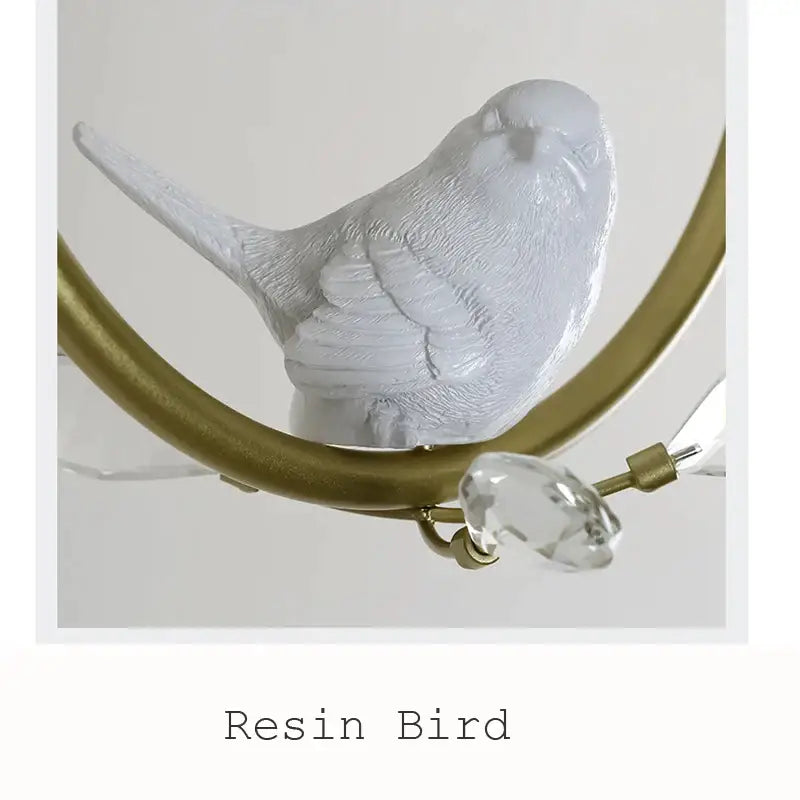 White resin bird figurine with detailed feathers perched on gold frame in modern black ceiling light fixture for corridor entrance