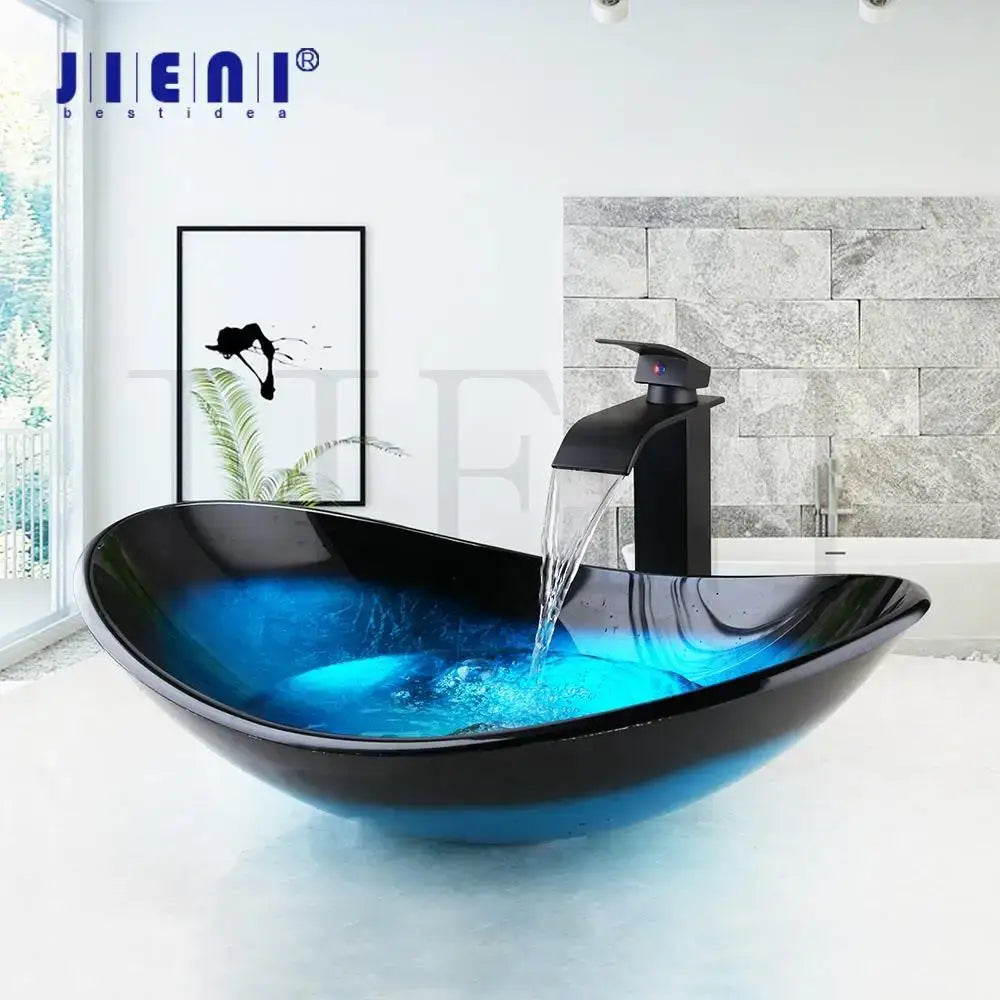 Black glass vessel sink basin tap set with blue illuminated water flowing from matching black faucet for bathroom use