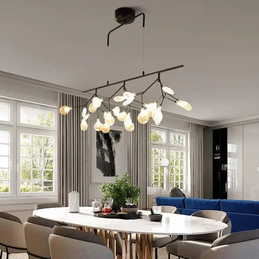 Modern black metal branching chandelier with frosted glass globe bulbs for dining room lighting