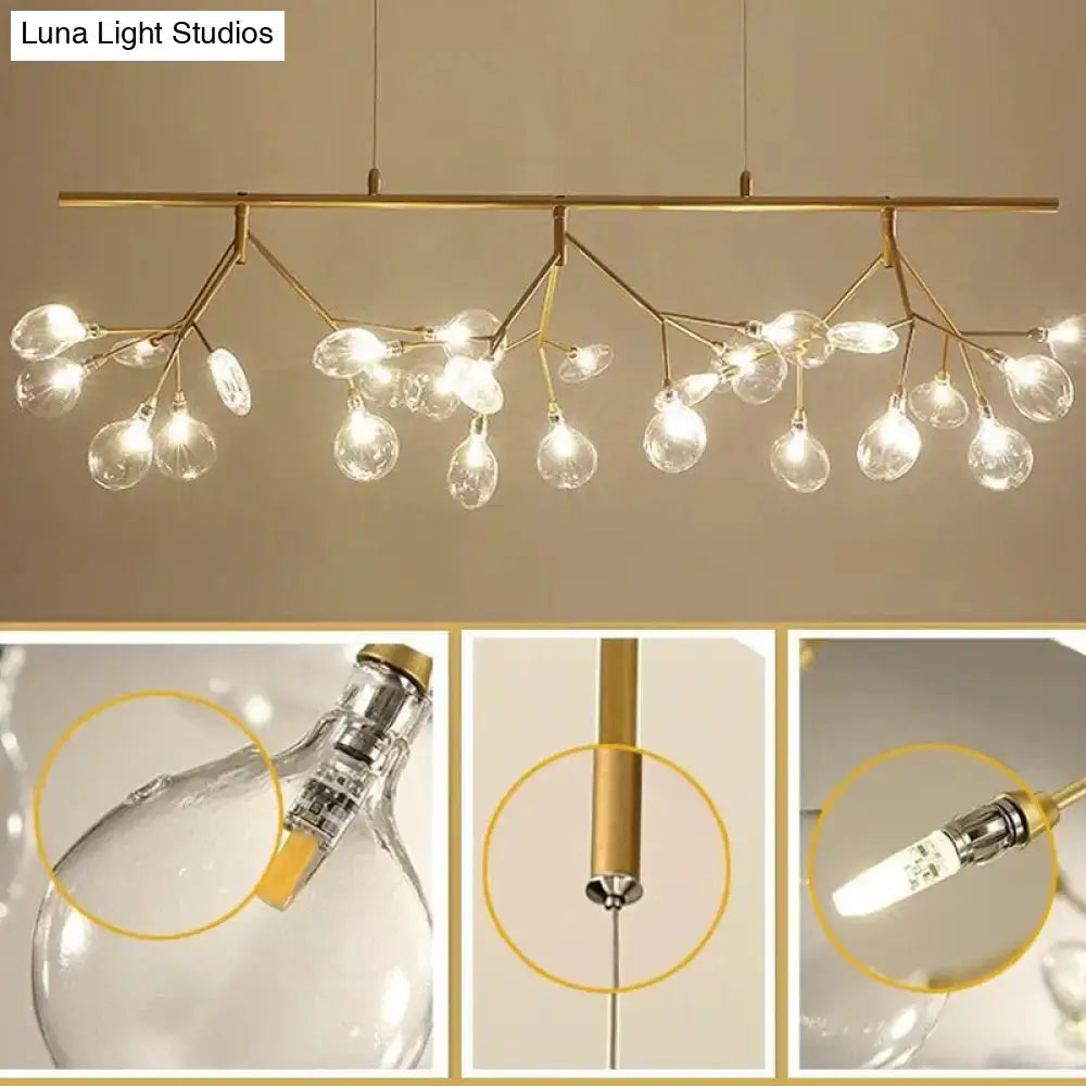 Gold-toned branch-style pendant light fixture with clear glass globe bulbs for modern black branching chandelier dining room