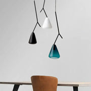 Three modern black branching glass pendant lights with conical shades in black white and teal for dining rooms