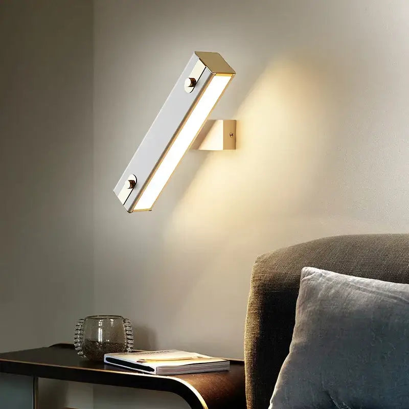 Modern black and brass decorbites adjustable led wall lamp with sleek metallic finish and warm diffused illumination