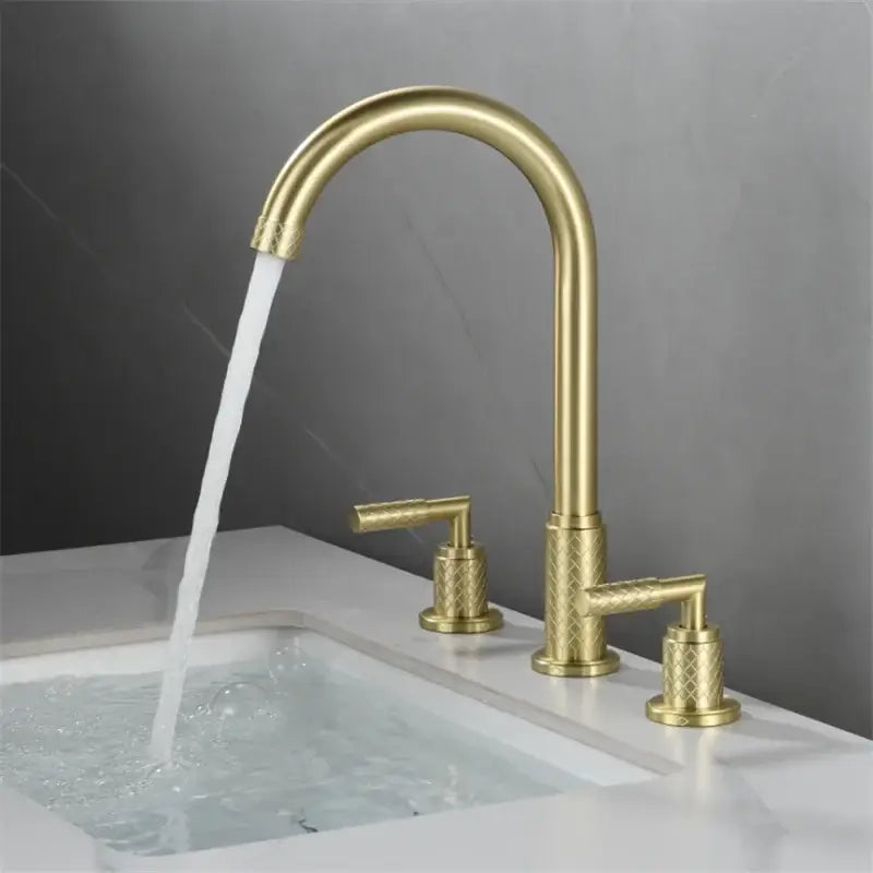Modern black brass basin faucet with gold-toned curved spout and textured diamond-patterned decorbites black brass handles
