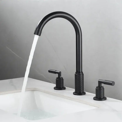 Modern black brass basin faucet with matte finish textured handles and curved spout on white sink decorbites black brass