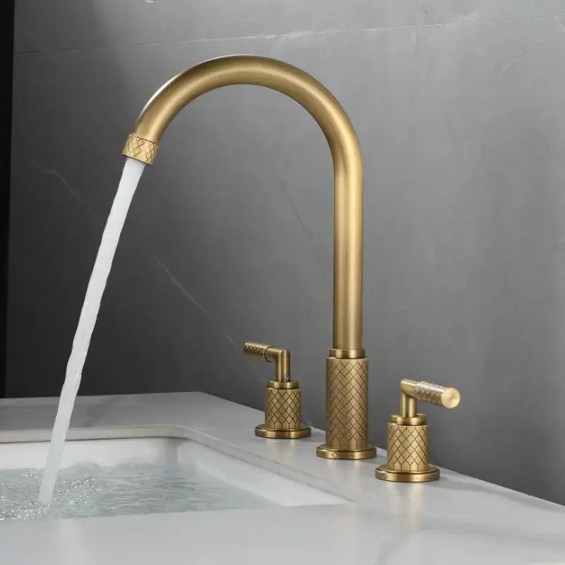Modern black brass basin faucet with brass finish, curved spout, and diamond-patterned textured handles decorbites black brass