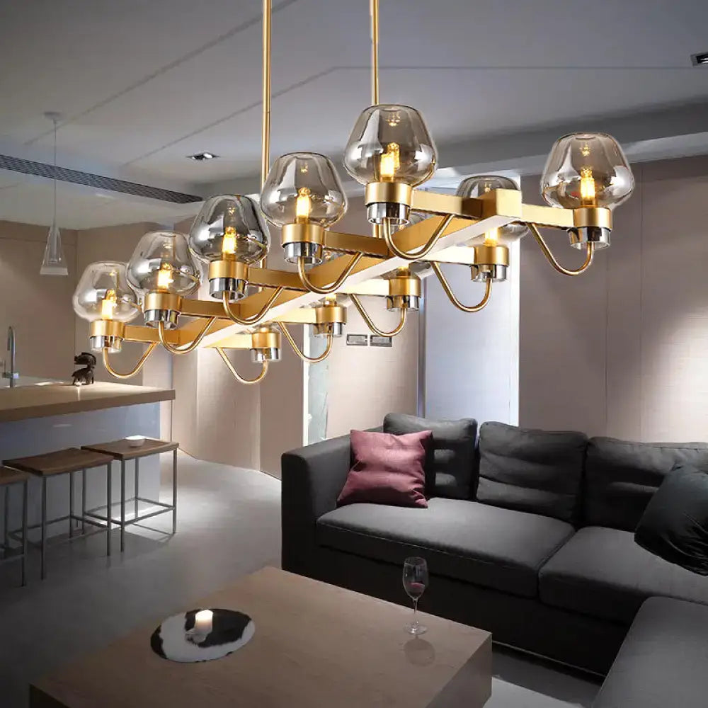 Gold-toned DecorBites™ contemporary island lamp with 10 smoked glass globes and metallic accents in clear amber smoke finish