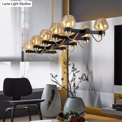 DecorBites™ contemporary island lamp with black metal frame, gold accents, and clear amber smoke glass globes, 110v-120v