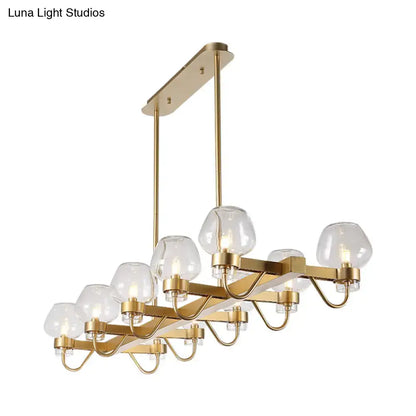 Gold-toned DecorBites™ contemporary island lamp with 10 clear amber smoke glass bulbs in black brass finish 110v-120v