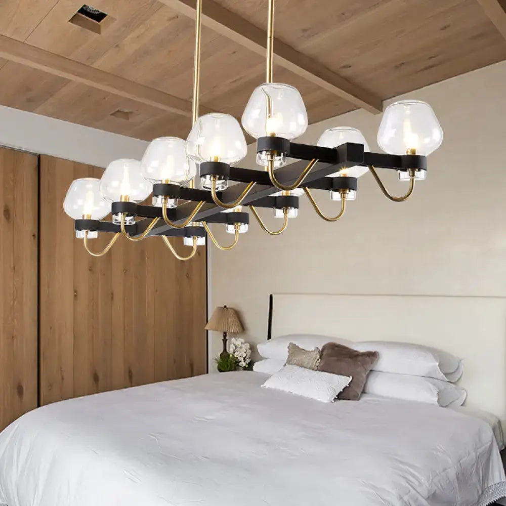 Modern DecorBites contemporary island chandelier with black brass finish and frosted glass globes in clear amber smoke