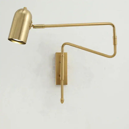 Brass-finished decorbites adjustable long-arm wall lamp with sleek articulated arm and cylindrical shade for bedroom use